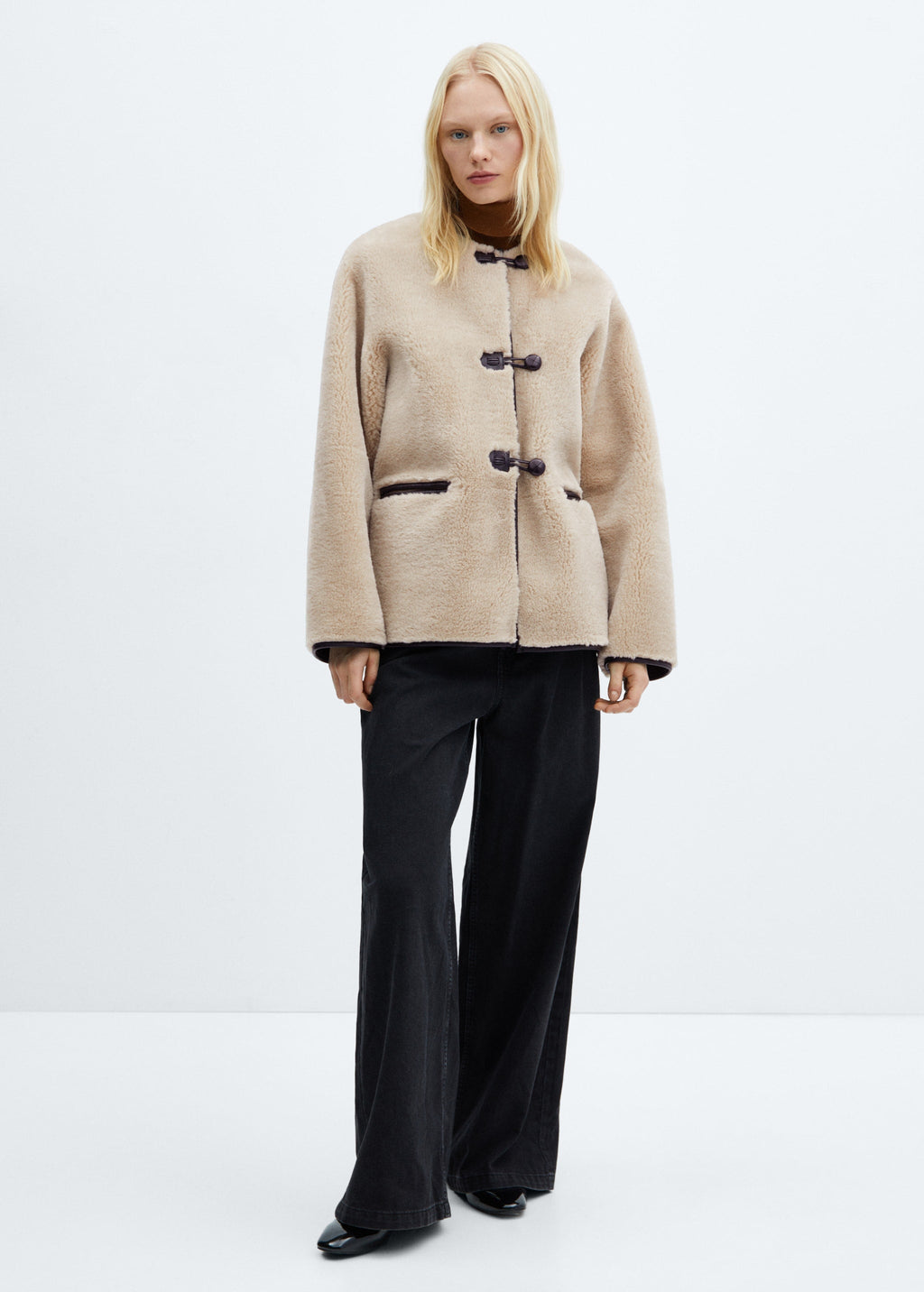 Faux fur coat with applications