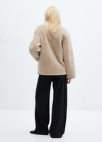 Faux fur coat with applications